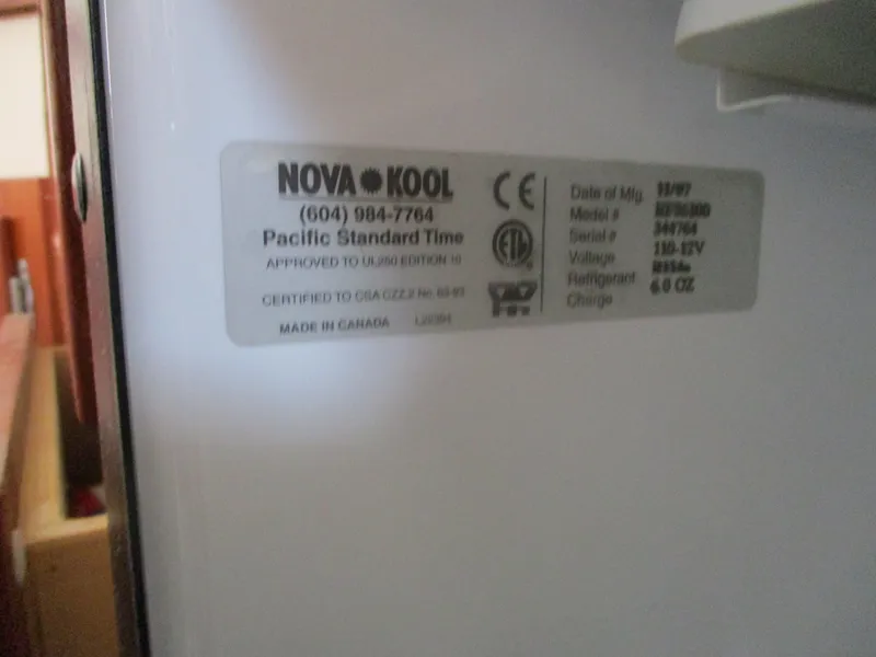 Slide: The Image of Label on Nova Kool appliance inside 1998 Nordic Tug 32 boat. - 23