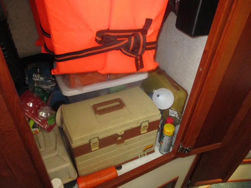 Slide: The Image of Storage compartment in a 1998 Nordic Tug 32 with life jacket and supplies. - 29