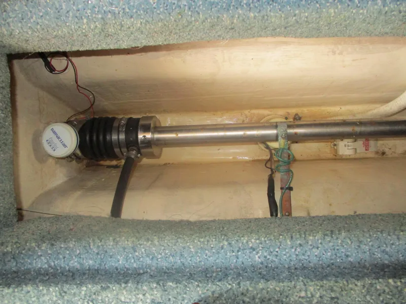 Slide: The Image of 1998 Nordic Tug 32 propeller shaft and bilge area with wiring and components. - 31