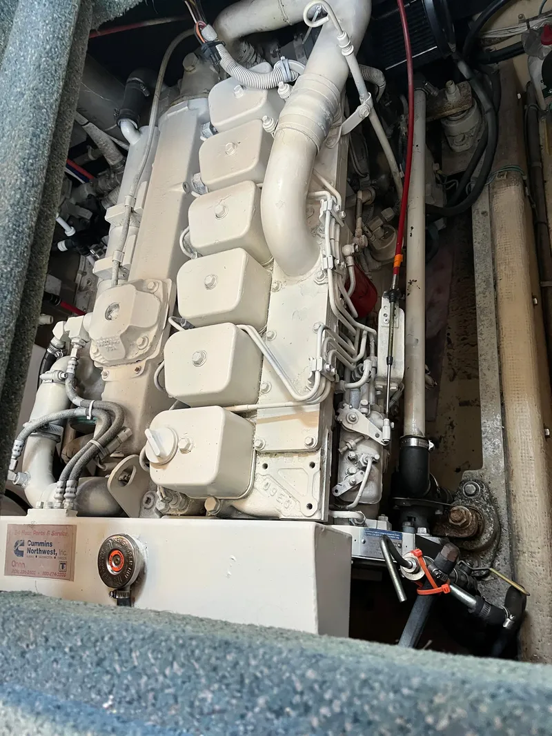 Slide: The Image of Engine compartment of a 1998 Nordic Tug 32, featuring a Cummins marine engine. - 32
