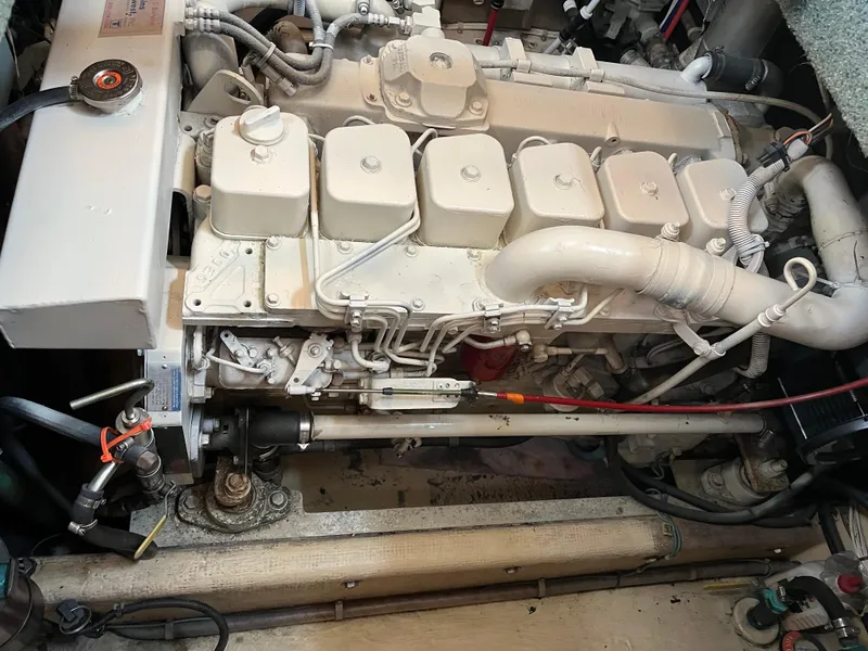 Slide: The Image of Engine compartment of a 1998 Nordic Tug 32, showcasing detailed mechanical components. - 33