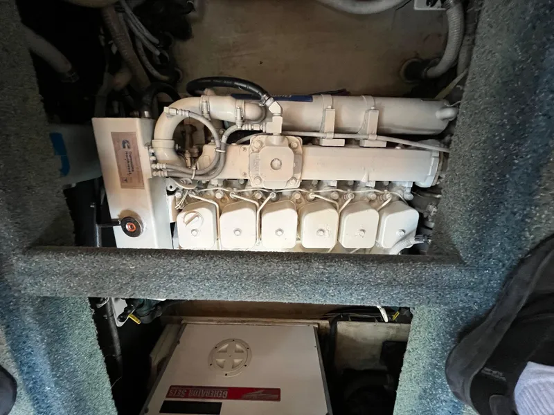 Slide: The Image of Engine compartment of a 1998 Nordic Tug 32, featuring a Cummins marine engine. - 34