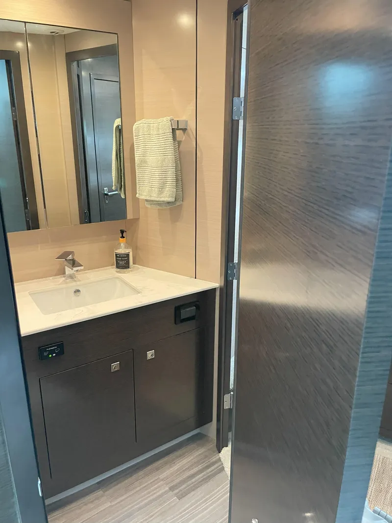 Slide: The Image of Luxurious bathroom in 2021 Cruisers Yachts 54 Cantius with modern fixtures and elegant design. - 10