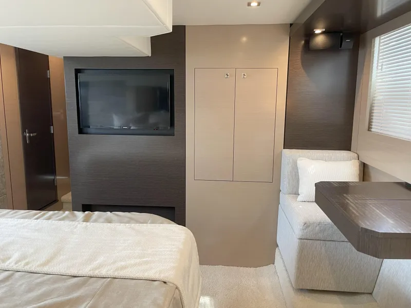 Slide: The Image of Luxurious interior of 2021 Cruisers Yachts 54 Cantius with modern furnishings and TV. - 17