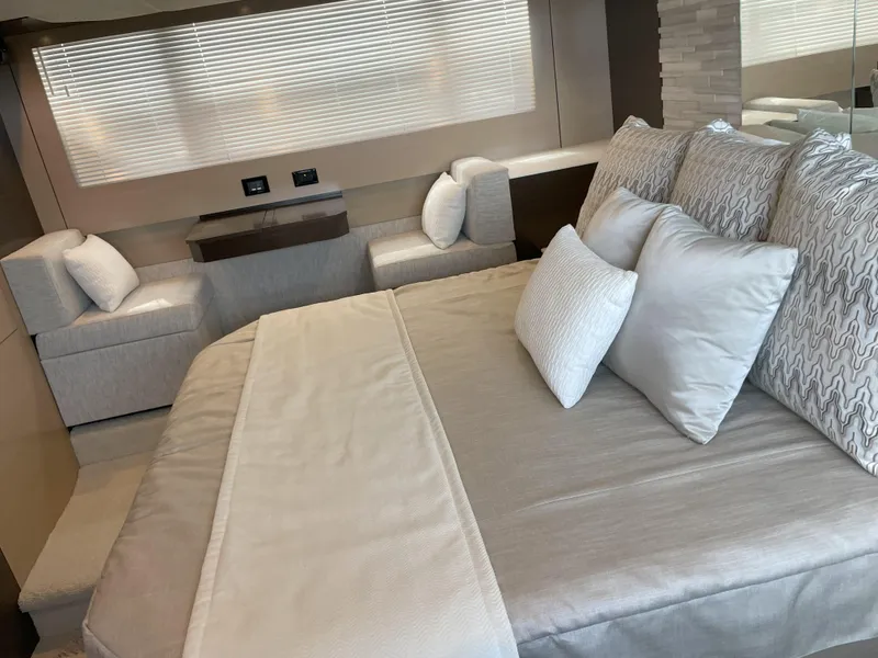 Slide: The Image of Luxurious bedroom interior of 2021 Cruisers Yachts 54 Cantius with elegant bedding and seating. - 19