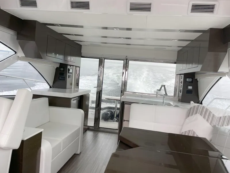 Slide: The Image of Luxurious interior of 2021 Cruisers Yachts 54 Cantius with modern seating and sleek design. - 25