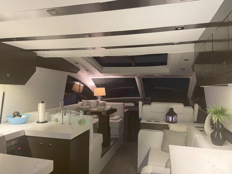 Slide: The Image of Luxurious interior of 2021 Cruisers Yachts 54 Cantius with modern furnishings and ambient lighting. - 3