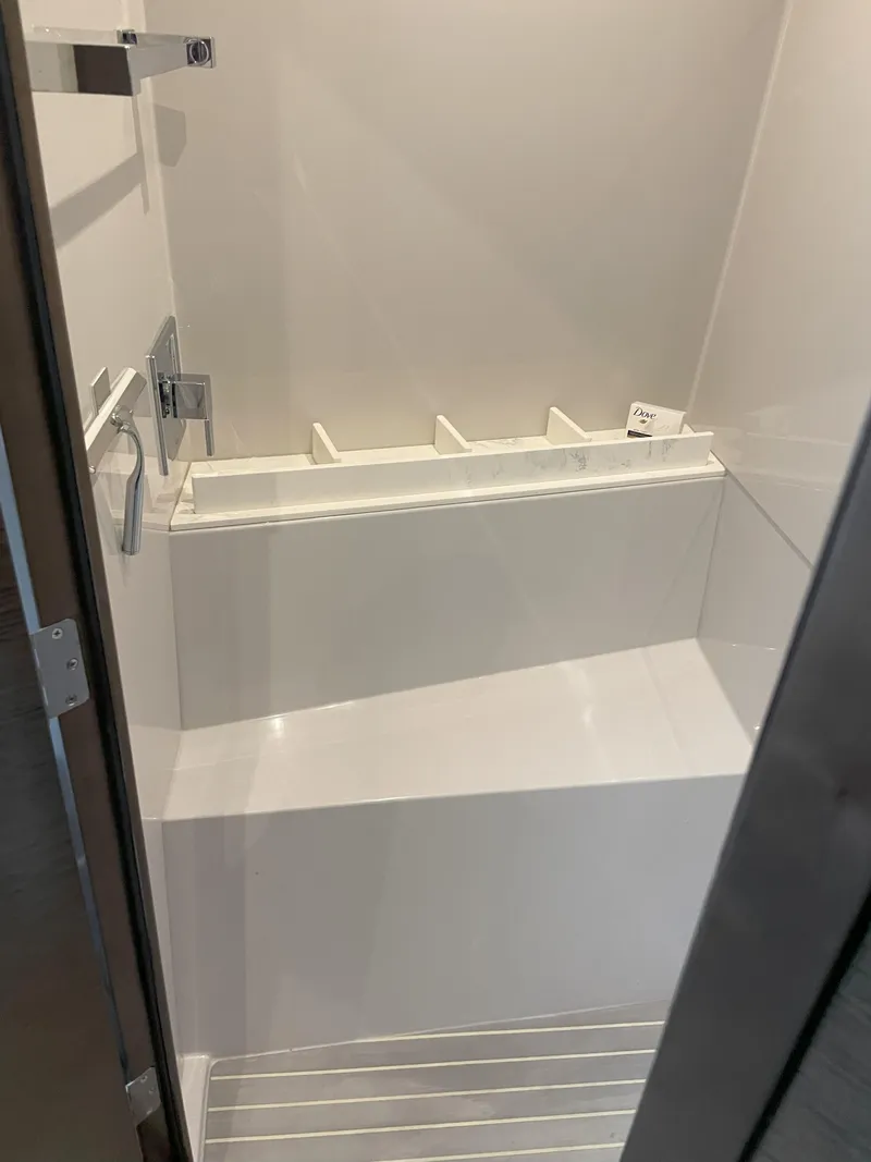 Slide: The Image of 2021 Cruisers Yachts 54 Cantius shower interior with sleek, modern design. - 30