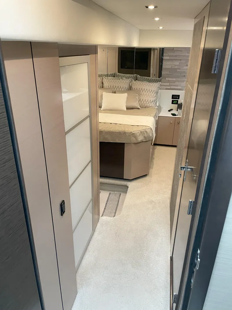 Slide: The Image of 2021 Cruisers Yachts 54 Cantius interior cabin with modern design and cozy bedding. - 31