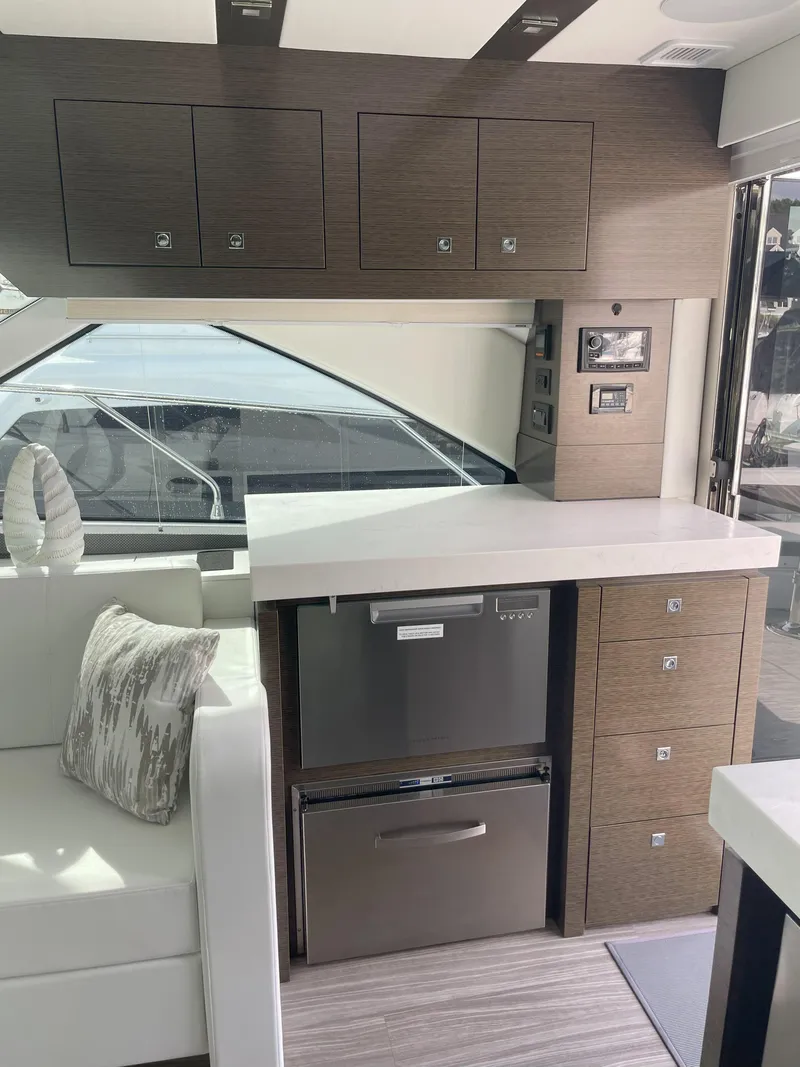 Slide: The Image of 2021 Cruisers Yachts 54 Cantius interior with modern kitchen and sleek cabinetry. - 47