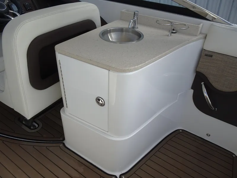 Slide: The Image of 2018 Cobalt R30 boat interior with sink and storage compartment. - 15