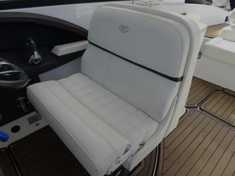 Slide: The Image of 2018 Cobalt R30 boat with white leather seating and teak flooring. - 19