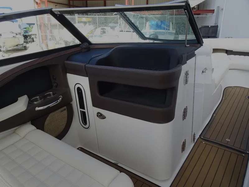 Slide: The Image of 2018 Cobalt R30 boat interior with white seating and brown accents. - 22