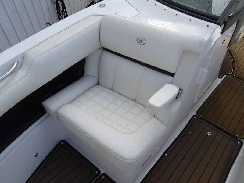 Slide: The Image of 2018 Cobalt R30 boat with white leather seating and wooden deck. - 25