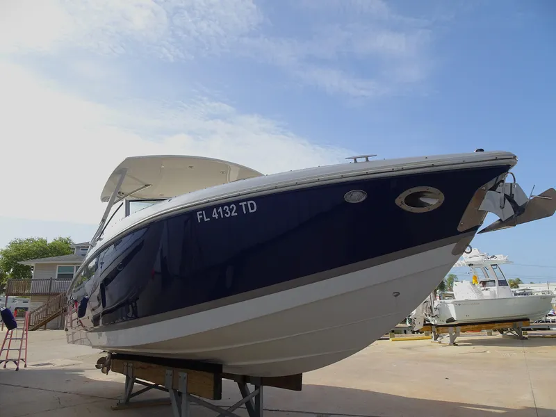 Slide: The Image of 2018 Cobalt R30 boat on a trailer, side view, blue and white hull. - 4