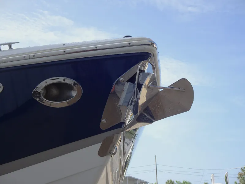 Slide: The Image of Close-up of a 2018 Cobalt R30 boat's anchor and bow under a clear sky. - 9