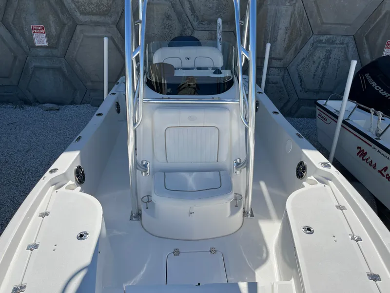 Slide: The Image of 2015 Sea Fox 220 Viper boat interior with seating and storage compartments. - 6