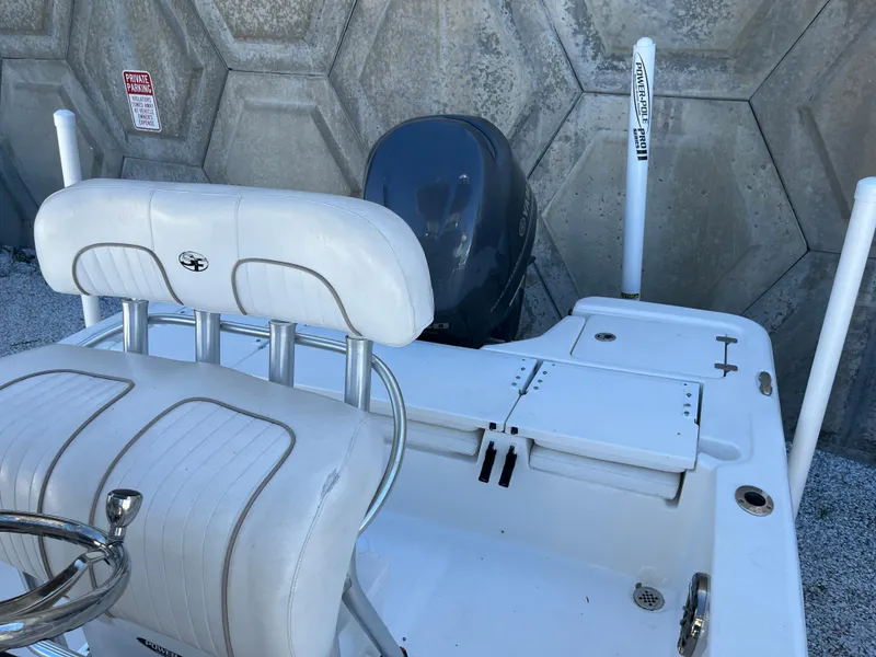 Slide: The Image of 2015 Sea Fox 220 Viper boat with white seating and outboard motor. - 7