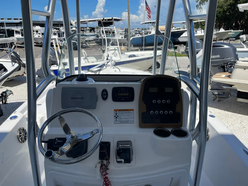Slide: The Image of 2015 Sea Fox 220 Viper boat console with steering wheel and navigation controls. - 8