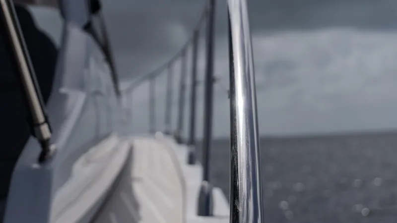 Slide: The Image of 2023 Azimut Atlantis 45 yacht railing with ocean backdrop. - 11
