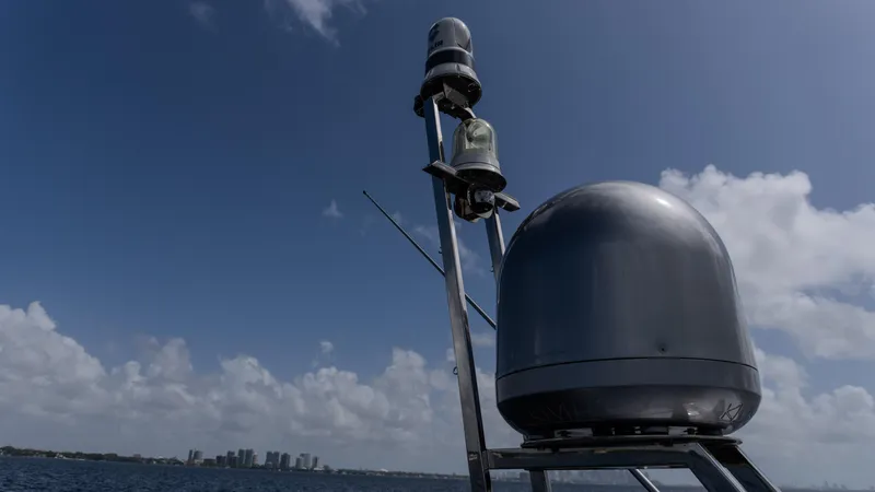 Slide: The Image of Radar and navigation equipment on 2023 Azimut Atlantis 45 yacht against a cloudy sky. - 14
