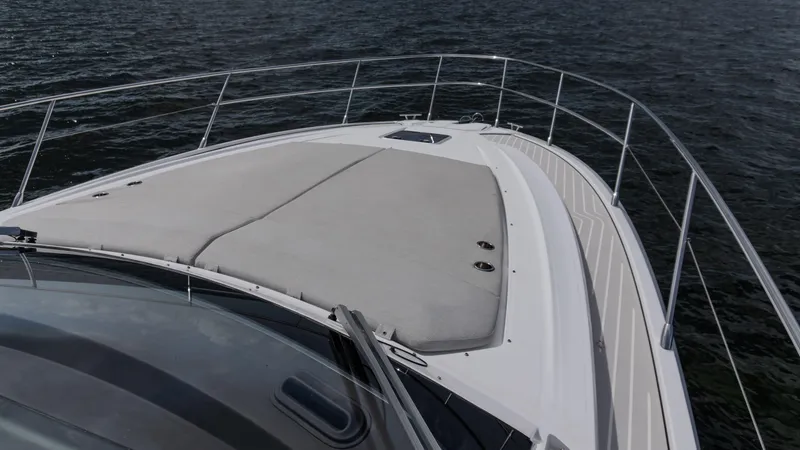 Slide: The Image of 2023 Azimut Atlantis 45 yacht deck with sleek design on open water. - 17