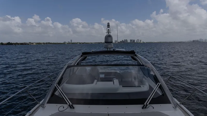 Slide: The Image of 2023 Azimut Atlantis 45 yacht cruising on open water under a cloudy sky. - 22