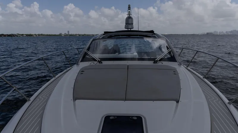 Slide: The Image of 2023 Azimut Atlantis 45 yacht cruising on open water under a cloudy sky. - 23