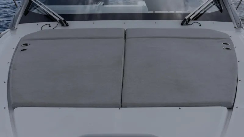 Slide: The Image of 2023 Azimut Atlantis 45 yacht sunbathing deck with cushioned seating. - 25