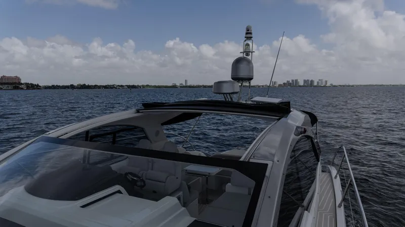 Slide: The Image of 2023 Azimut Atlantis 45 yacht cruising on open water under a cloudy sky. - 26