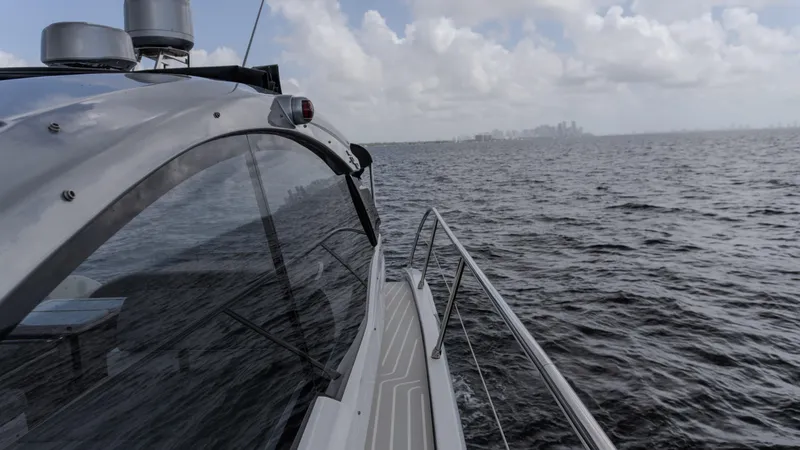 Slide: The Image of 2023 Azimut Atlantis 45 yacht cruising on open water under cloudy skies. - 28