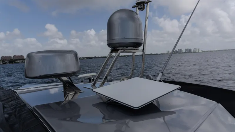 Slide: The Image of 2023 Azimut Atlantis 45 yacht with advanced navigation equipment on deck, cruising on open water. - 33