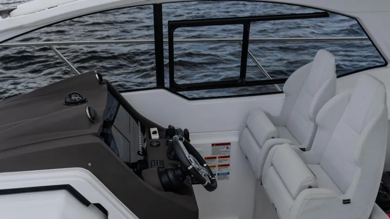 Slide: The Image of 2023 Azimut Atlantis 45 yacht cockpit with dual white seats and sleek controls. - 37