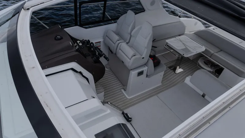 Slide: The Image of 2023 Azimut Atlantis 45 yacht cockpit with modern seating and control panel. - 39