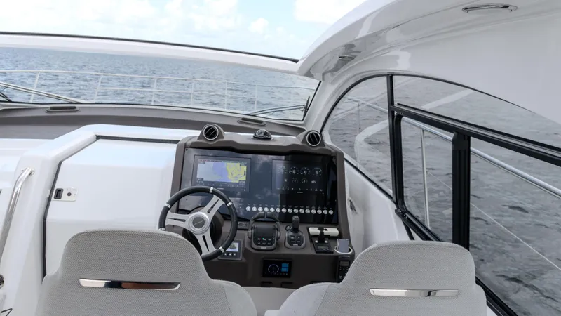 Slide: The Image of 2023 Azimut Atlantis 45 yacht cockpit with modern navigation system and ocean view. - 41