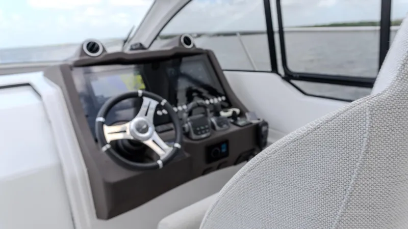 Slide: The Image of 2023 Azimut Atlantis 45 yacht helm with modern controls and steering wheel. - 43
