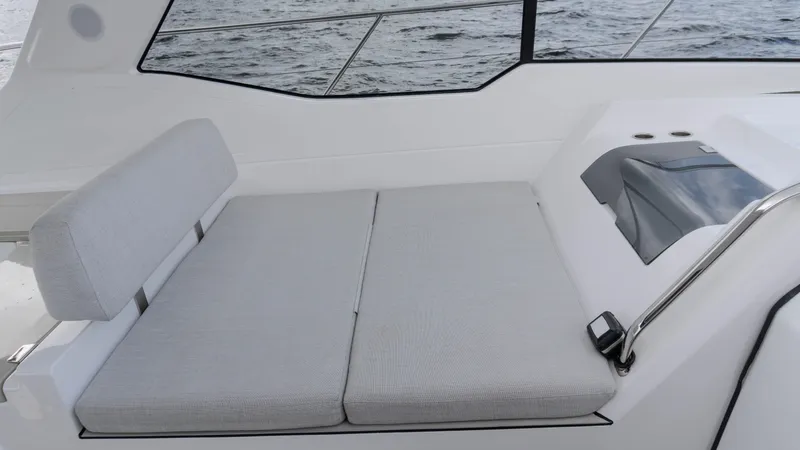 Slide: The Image of 2023 Azimut Atlantis 45 yacht interior with cushioned seating and ocean view. - 46