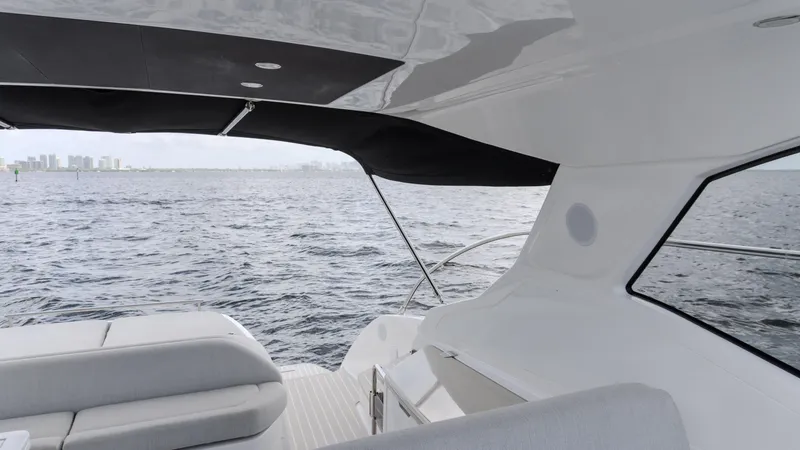 Slide: The Image of 2023 Azimut Atlantis 45 yacht interior with ocean view, featuring sleek seating and modern design. - 47