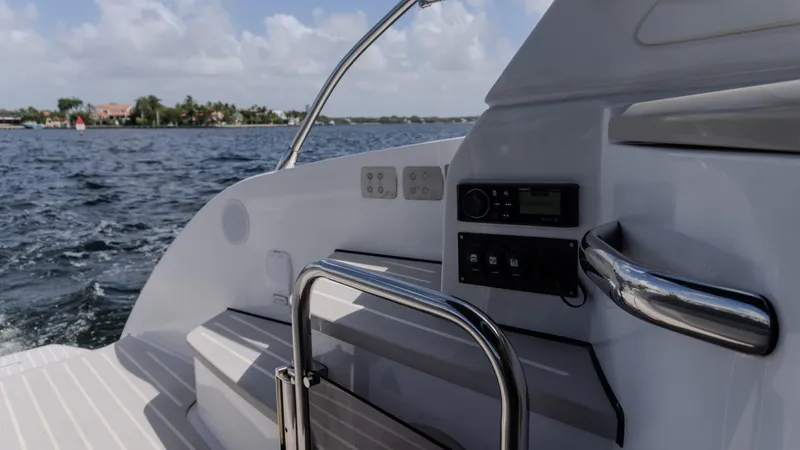 Slide: The Image of 2023 Azimut Atlantis 45 yacht deck with railing, control panel, and ocean view. - 6