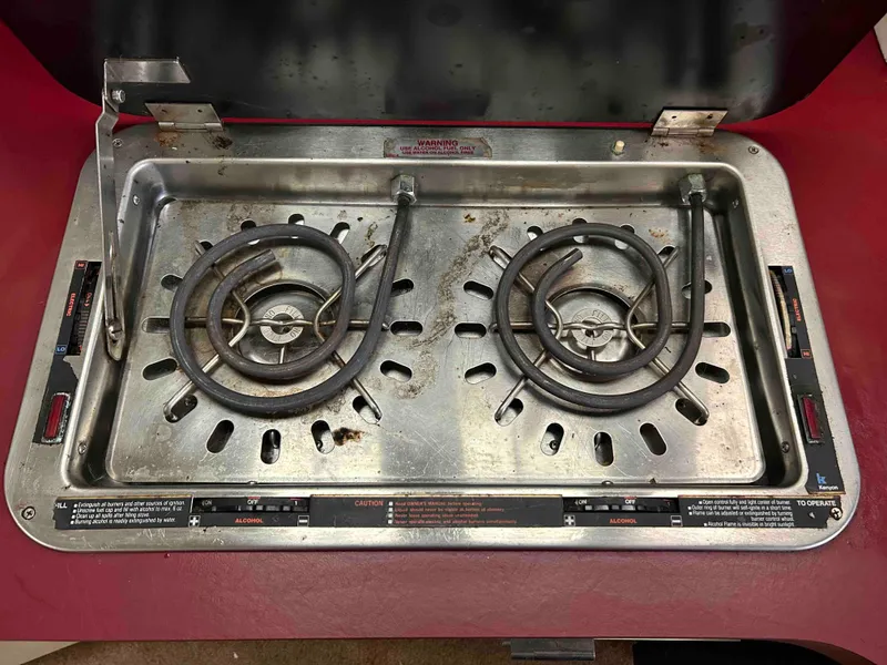 Slide: The Image of Stainless steel stove with two burners on a 1991 Silverton 34 Express Cruiser. - 20