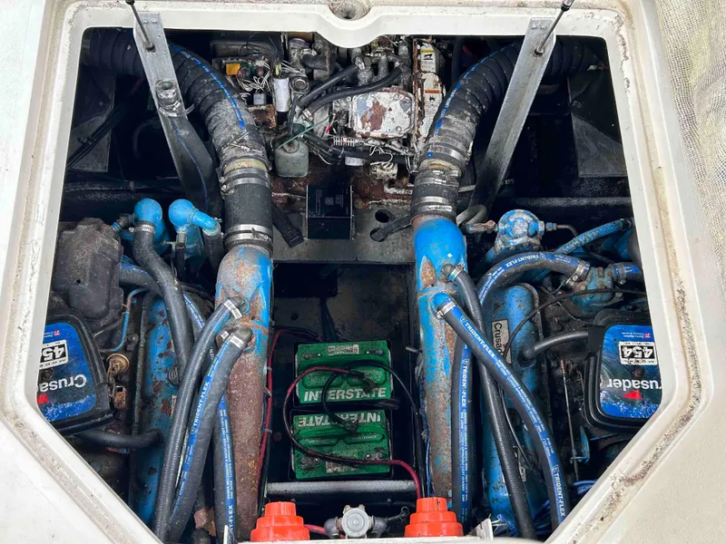 Slide: The Image of Engine compartment of a 1991 Silverton 34 Express Cruiser with visible components and wiring. - 27