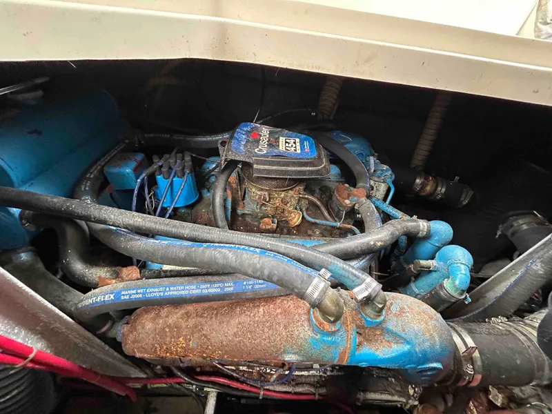 Slide: The Image of 1991 Silverton 34 Express Cruiser engine with visible hoses and components. - 29
