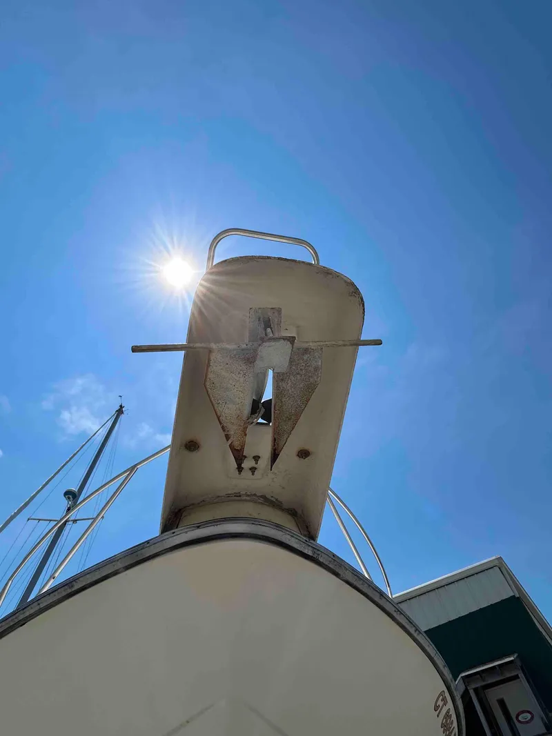 Slide: The Image of 1991 Silverton 34 Express Cruiser bow under bright sun and clear blue sky. - 3