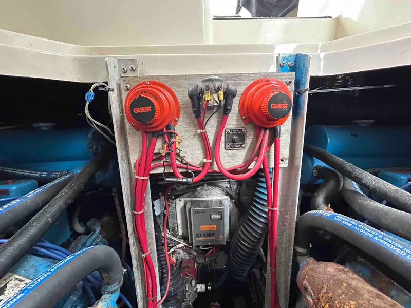 Slide: The Image of Engine compartment of a 1991 Silverton 34 Express Cruiser with wiring and components visible. - 30