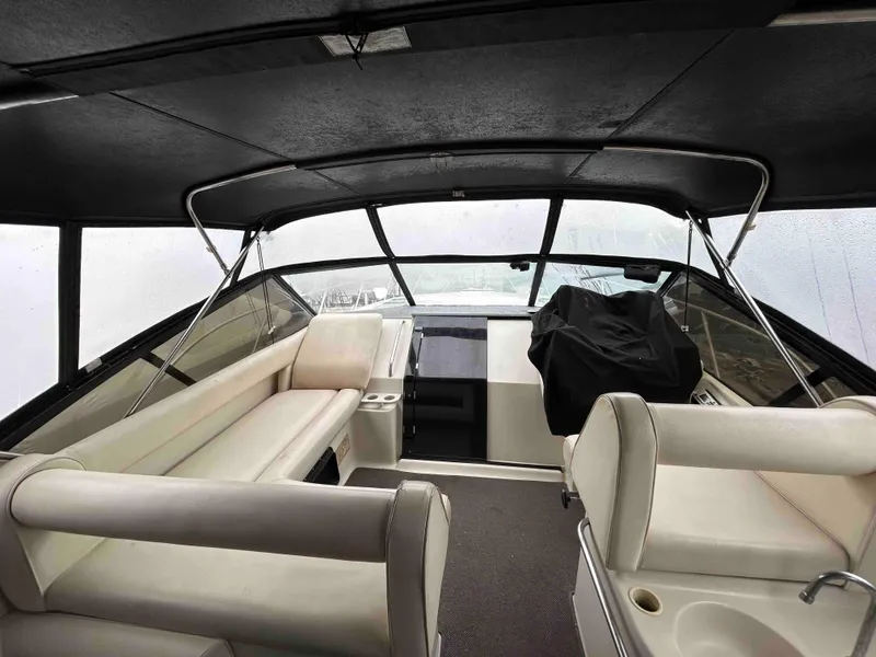 Slide: The Image of 1991 Silverton 34 Express Cruiser interior with seating and helm, featuring a sleek design. - 4