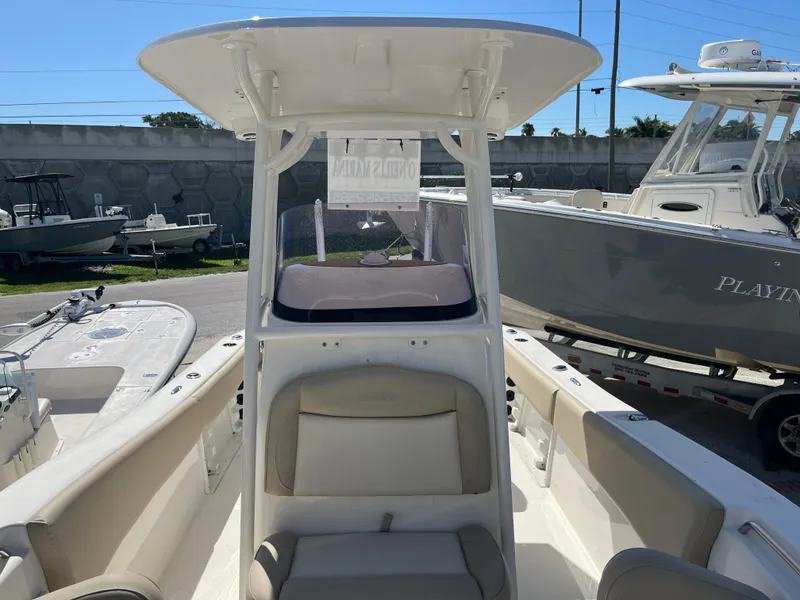 Slide: The Image of 2022 NauticStar 2302 Legacy boat interior with seating and T-top. - 5