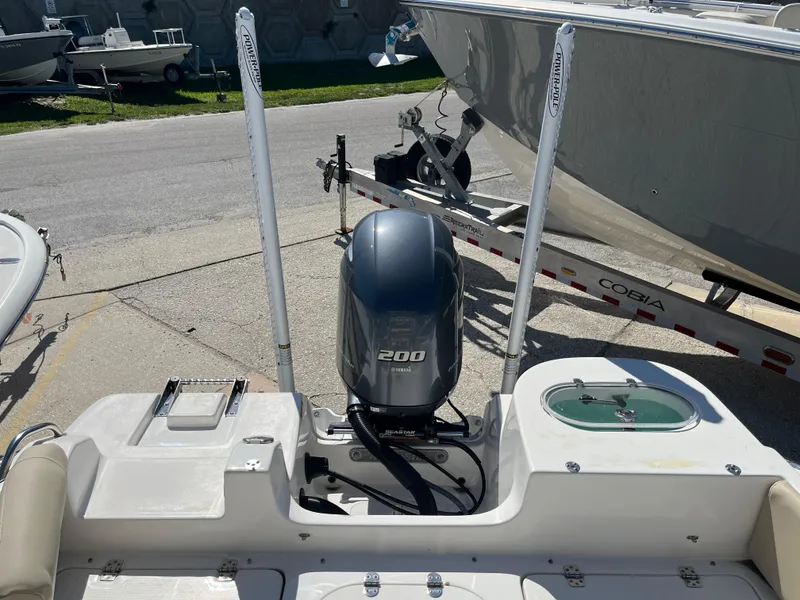 Slide: The Image of 2022 NauticStar 2302 Legacy boat with Yamaha 200 engine at a marina. - 8