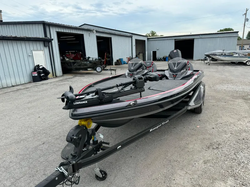 Slide: The Image of 2024 Ranger Z520R Ranger Cup Equipped boat parked outside a garage. - 2
