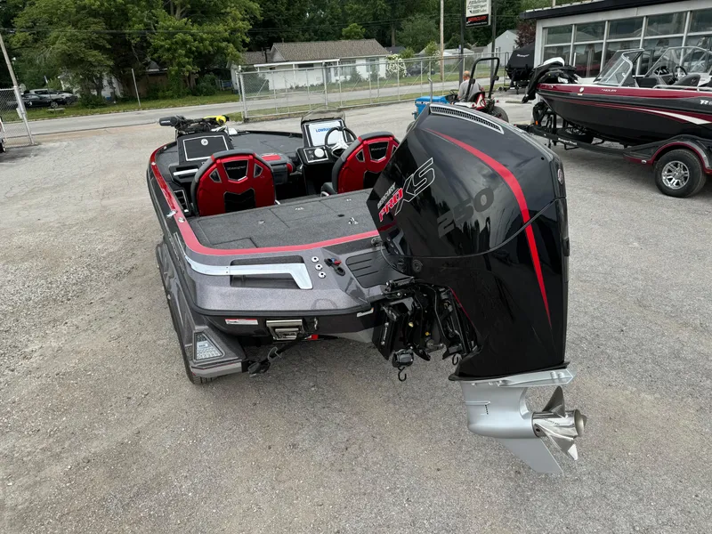 Slide: The Image of 2024 Ranger Z520R Ranger Cup Equipped boat with powerful outboard motor, parked outdoors. - 3