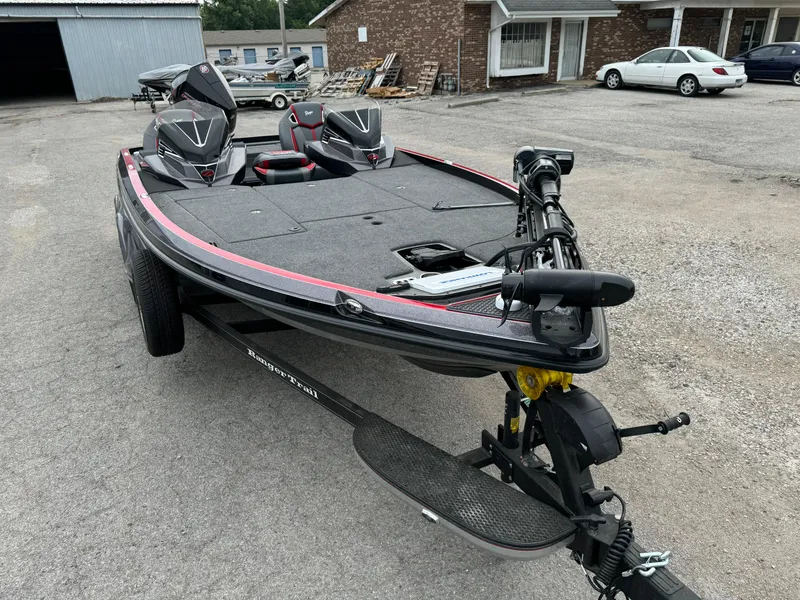 Slide: The Image of 2024 Ranger Z520R Ranger Cup Equipped boat on trailer in parking lot. - 8